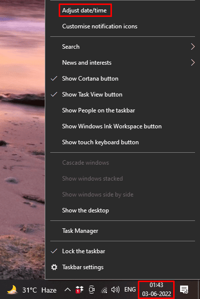 faites un clic droit sur l'option Heure et horloge et cliquez sur Ajuster la date/l'heure