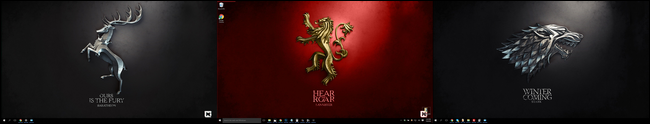 Latar belakang bertema Game of Thrones diatur secara acak di tiga desktop.