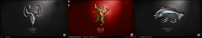 Os fundos de Game of Thrones dispostos deliberadamente em uma configuração de monitor triplo.