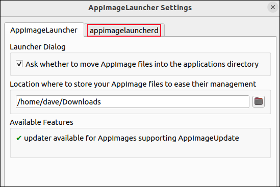 La aplicación AppImageLauncher con /home/dave/Downloads configurado como el directorio supervisado