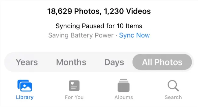 Appuyez sur "Synchroniser maintenant" pour forcer Photos à télécharger des médias exceptionnels