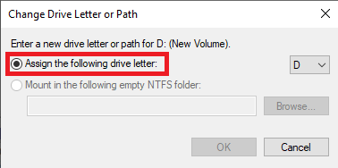 Di kotak dialog baru, pilih drop-down Assign the following drive letter